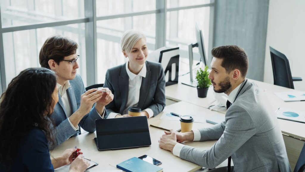 Professionals meeting around a working table